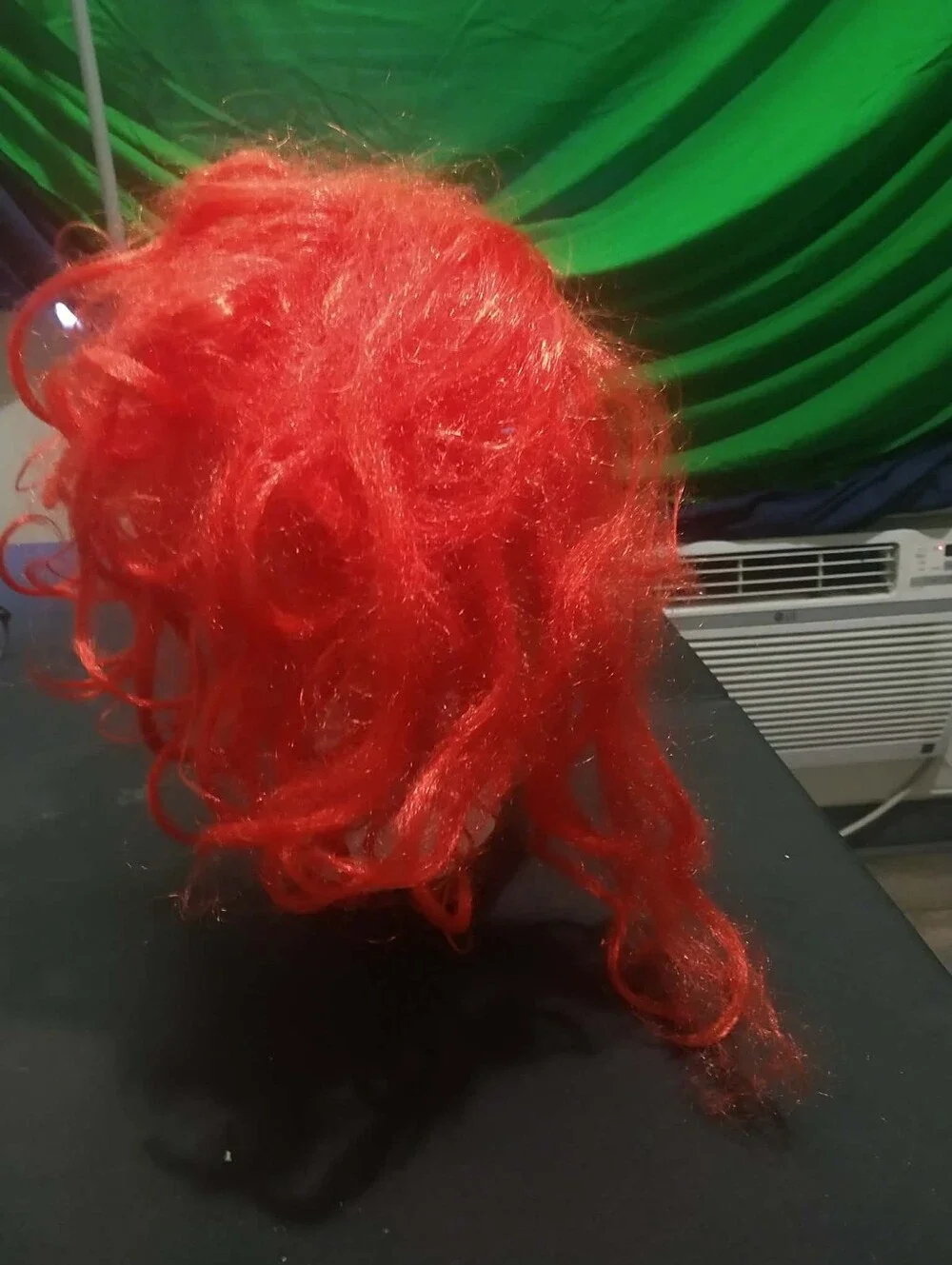 Warner Bros. / Rubie’s scary clown latex mask with bright red synthetic hair
